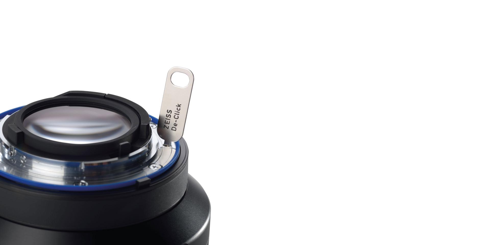 Close-up of a ZEISS lens featuring the innovative De-Click gear ring, designed for smooth aperture adjustments in professional video production.