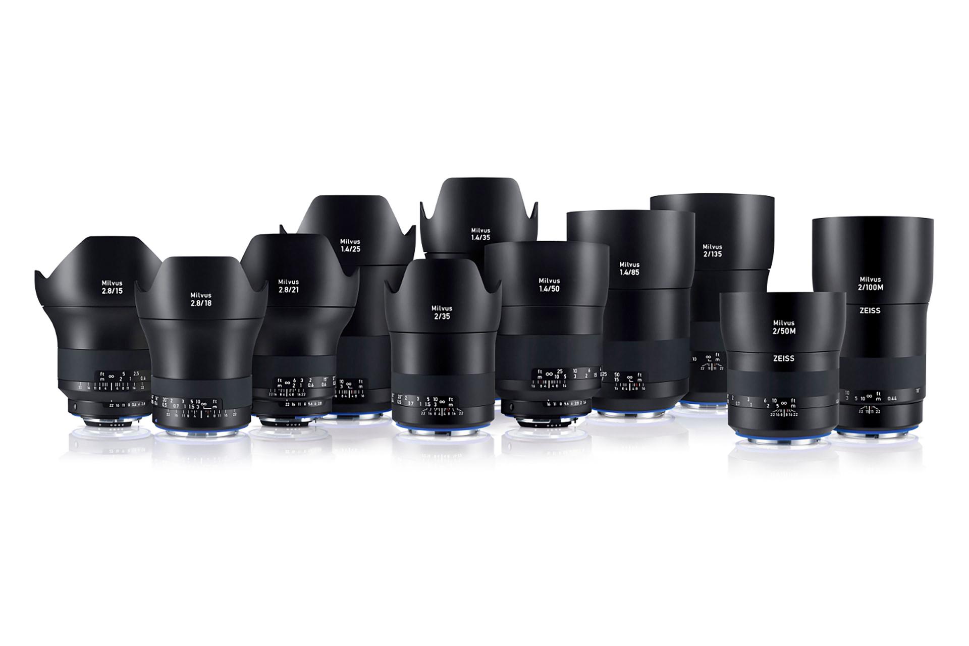A lineup of various ZEISS camera lenses arranged in rows on a white background.
