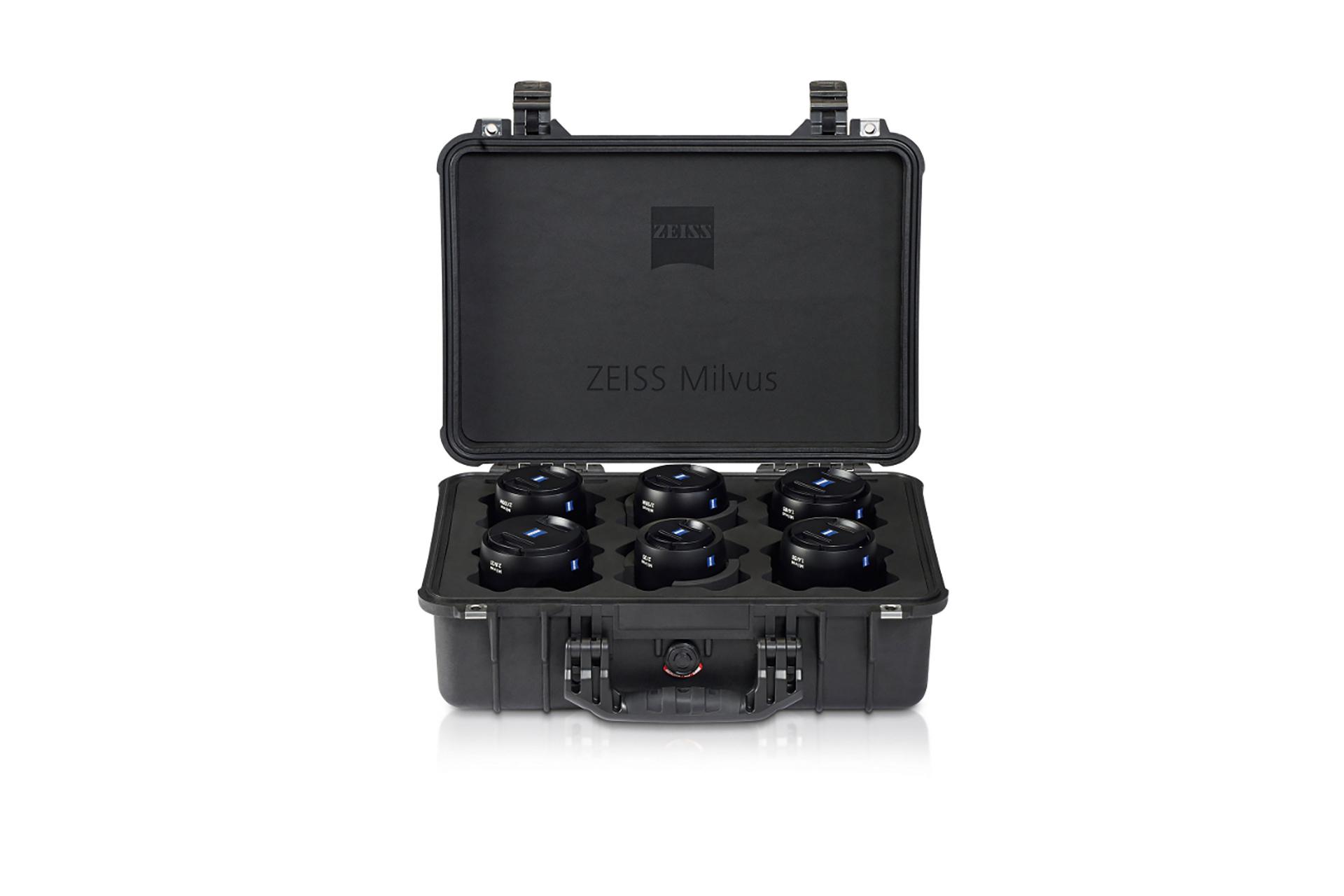 Black hard case with ZEISS branding, opened to display six ZEISS Milvus camera lenses securely arranged inside.