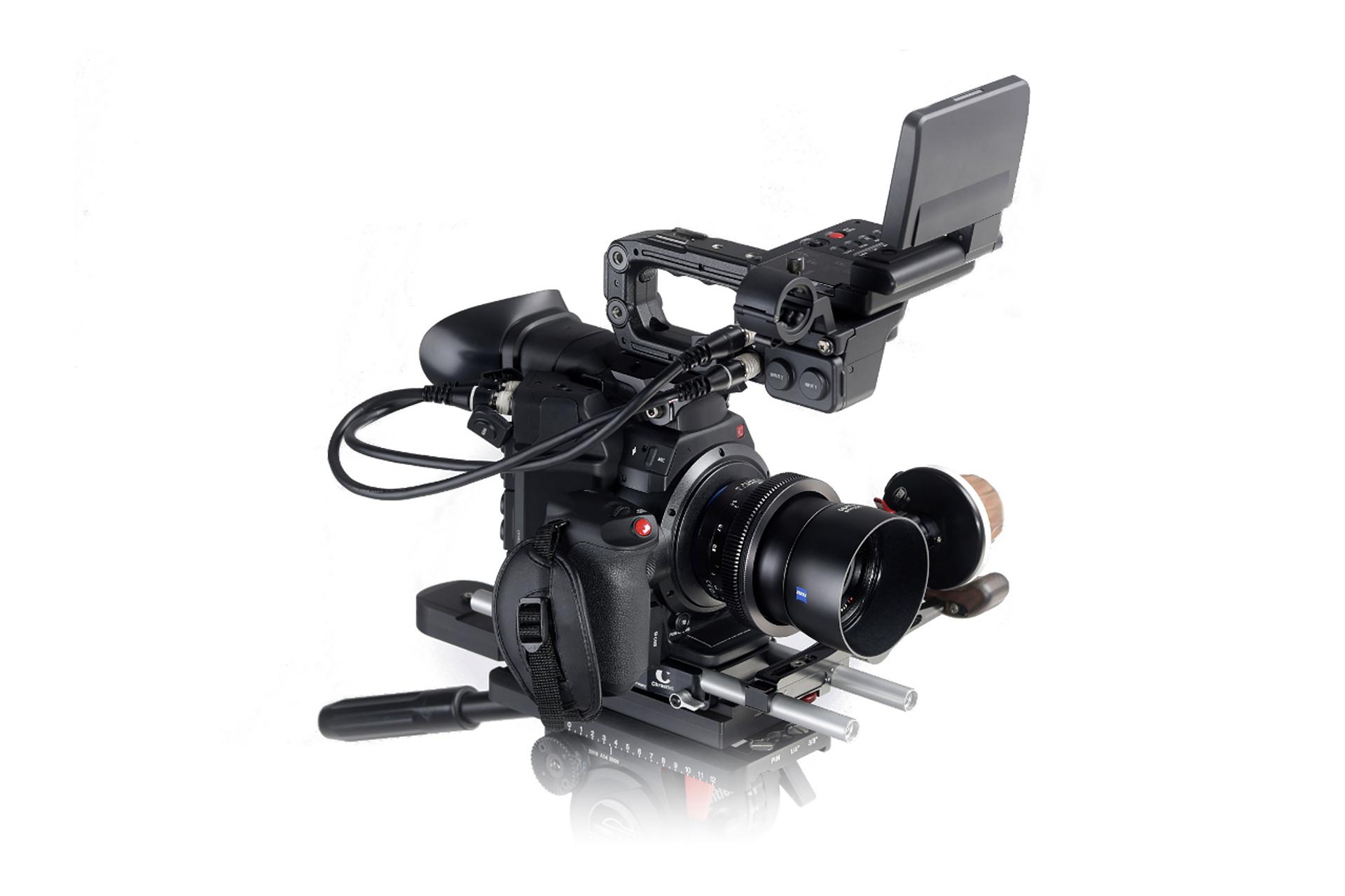 Professional video camera setup equipped with a ZEISS lens and mounted on a rig with an external monitor.