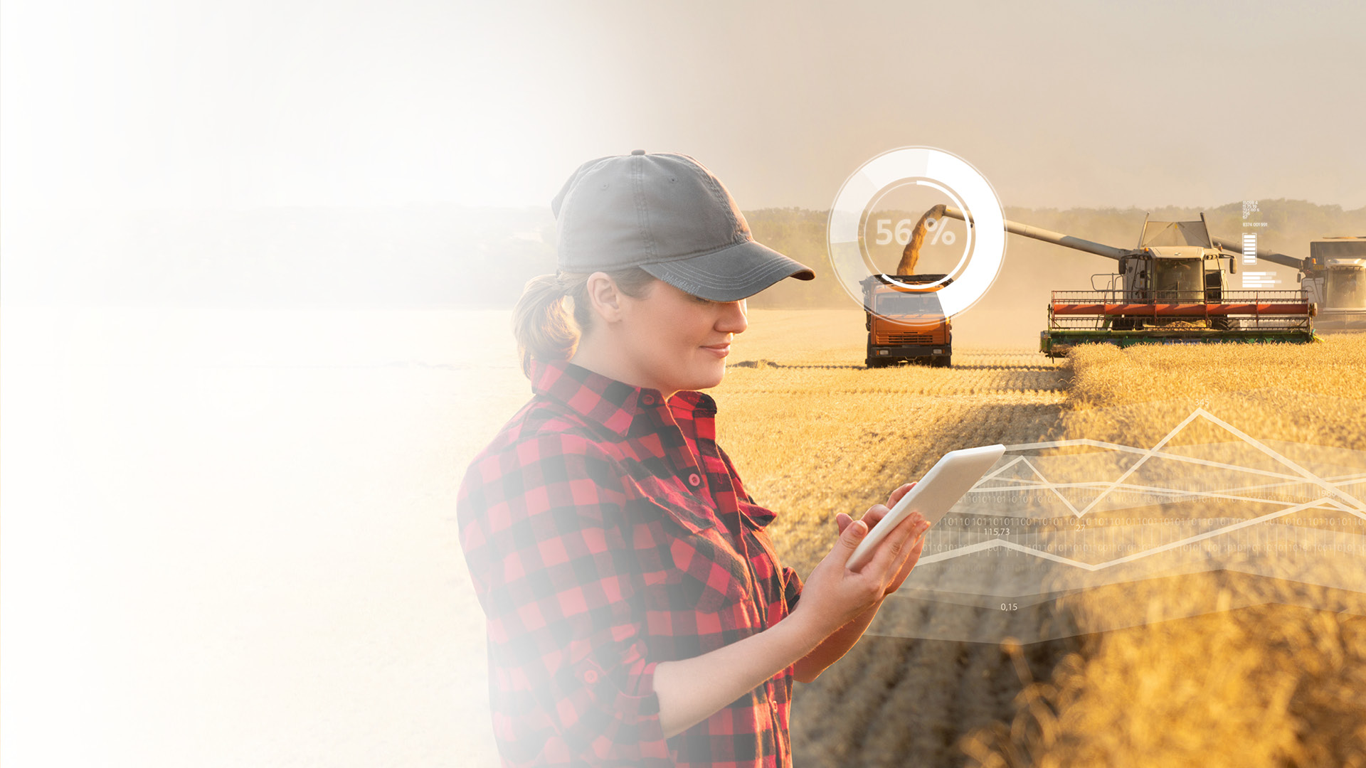 Woman farmer with digital tablet on a background of harvesters