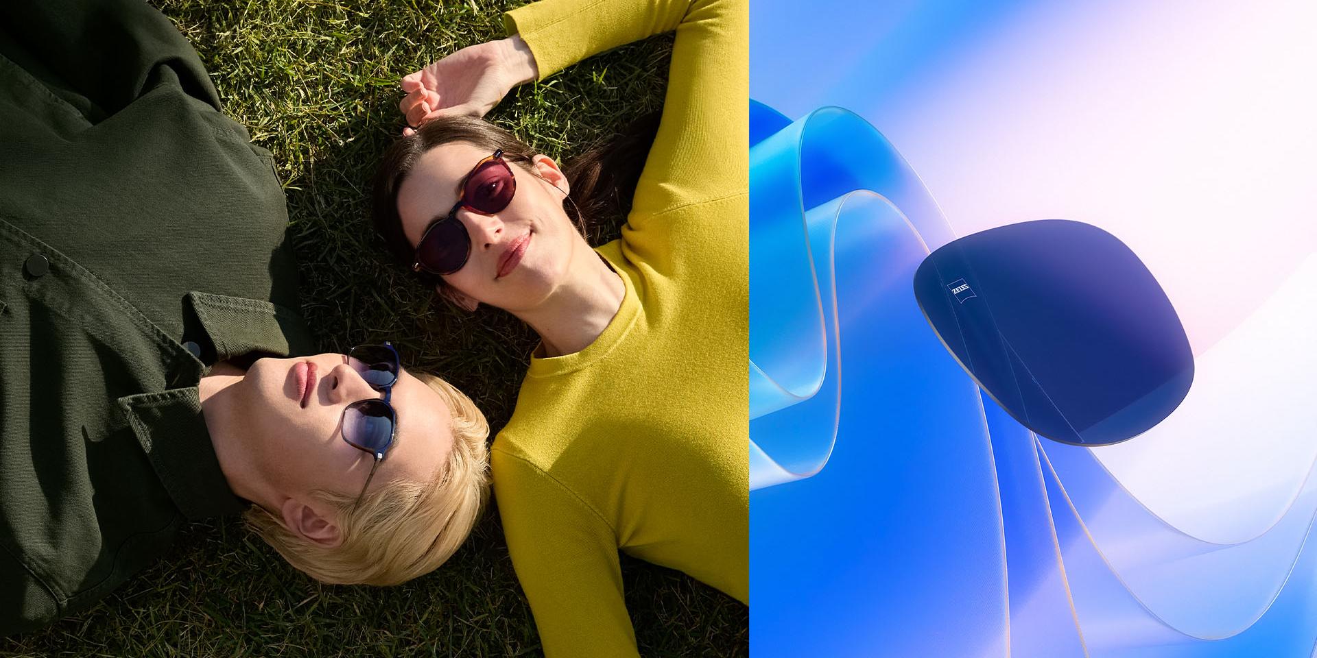 一对配戴着蔡司处方太阳镜的男女，在草地上悠然休憩，共同仰望天空。CGI展示：一片蔡司染色镜片悬浮着迎向阳光，生动展示其出色的紫外线阻隔性能。