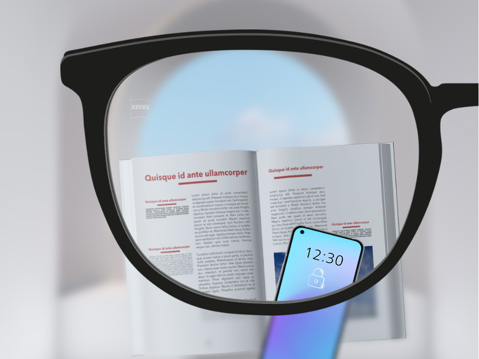 使用蔡司智锐单光镜片的视野，其以智能手机和书为背景，镜片呈现完全清晰的效果。